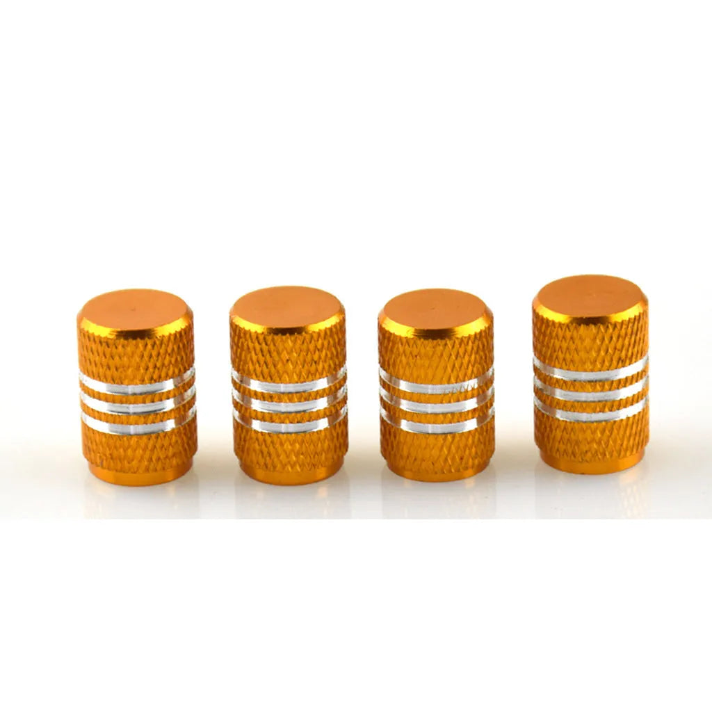 Set of coloured stainless steel car tyre valve caps in ten colours on a white background