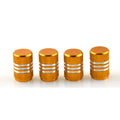 Set of coloured stainless steel car tyre valve caps in ten colours on a white background