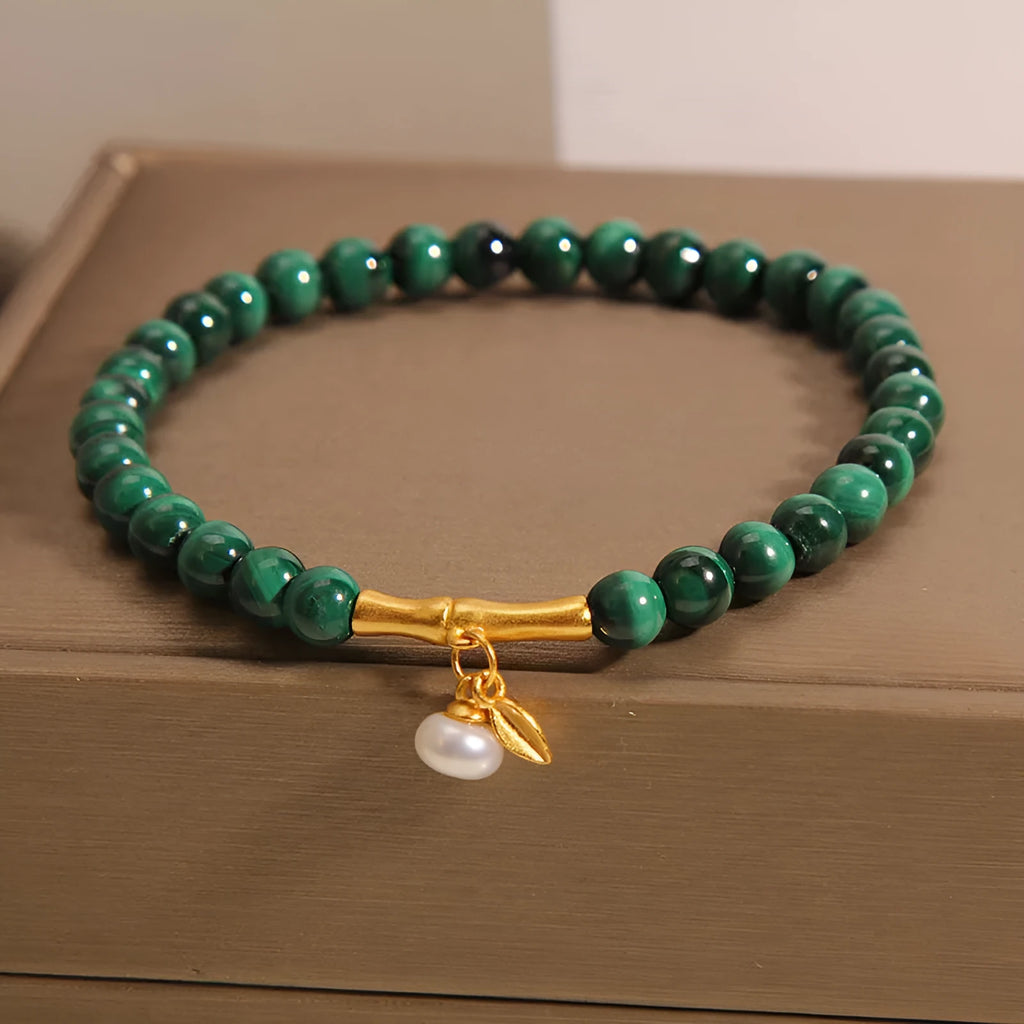 Women's lucky bamboo bracelet with white crystal beads on adjustable gold-toned chain