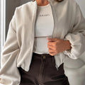 Women's off-shoulder short coat with lantern sleeves in polyester fabric, milky white colour option