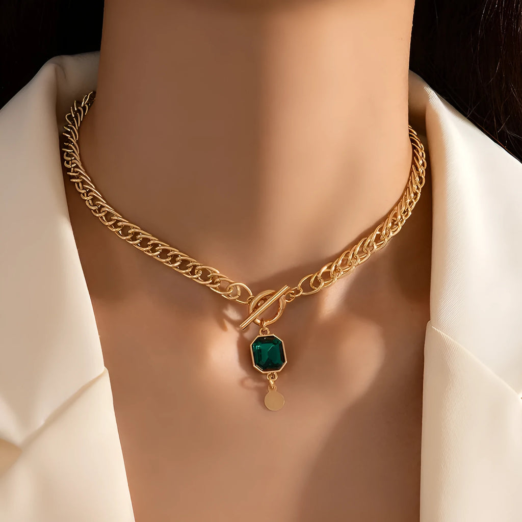 Gold electroplated titanium steel necklace with geometric round emerald zircon pendant on Cuban chain