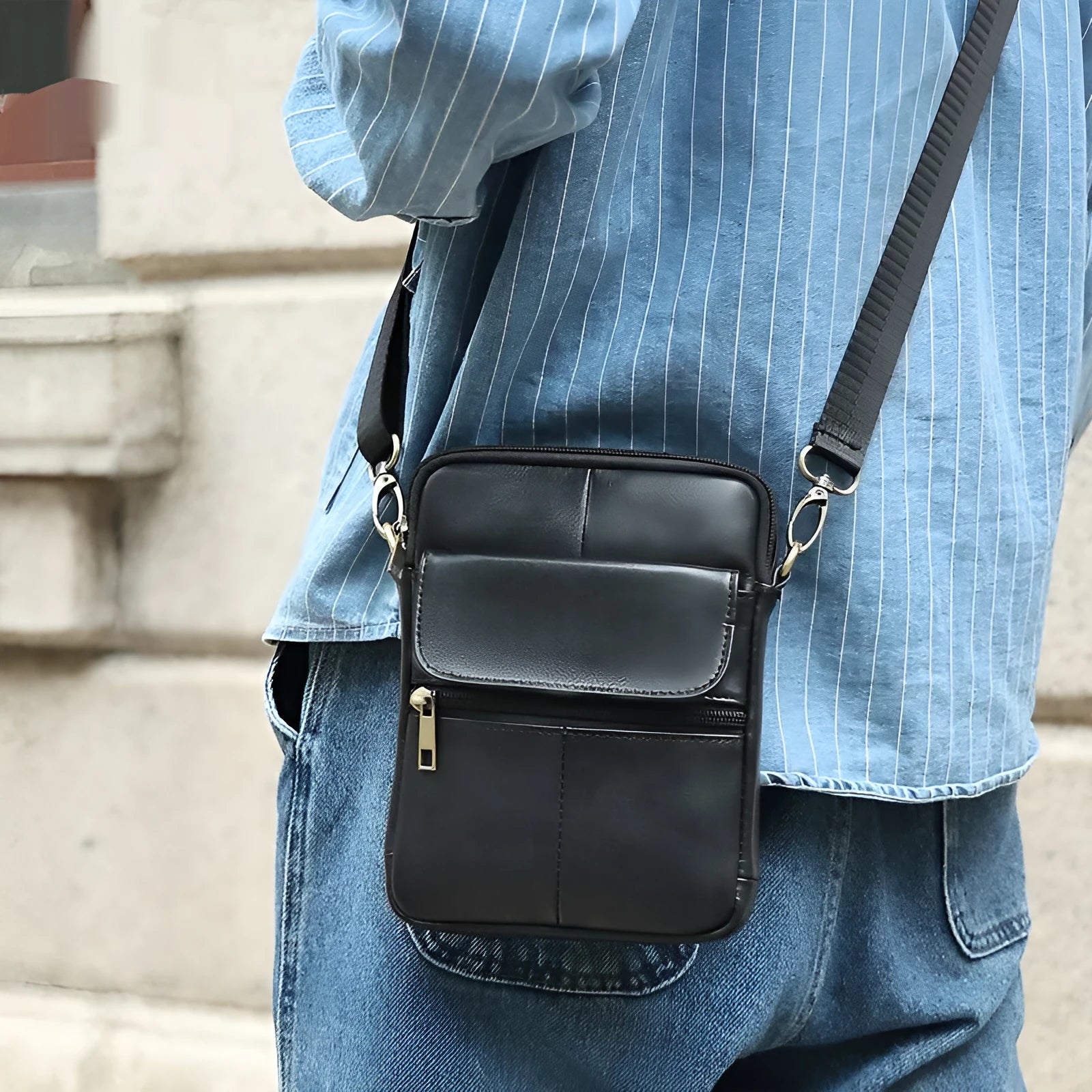 Men's brown genuine leather crossbody shoulder bag with visible stitching.