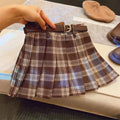 Girls red and black plaid pleated A-line skirt made from cotton blend fabric.