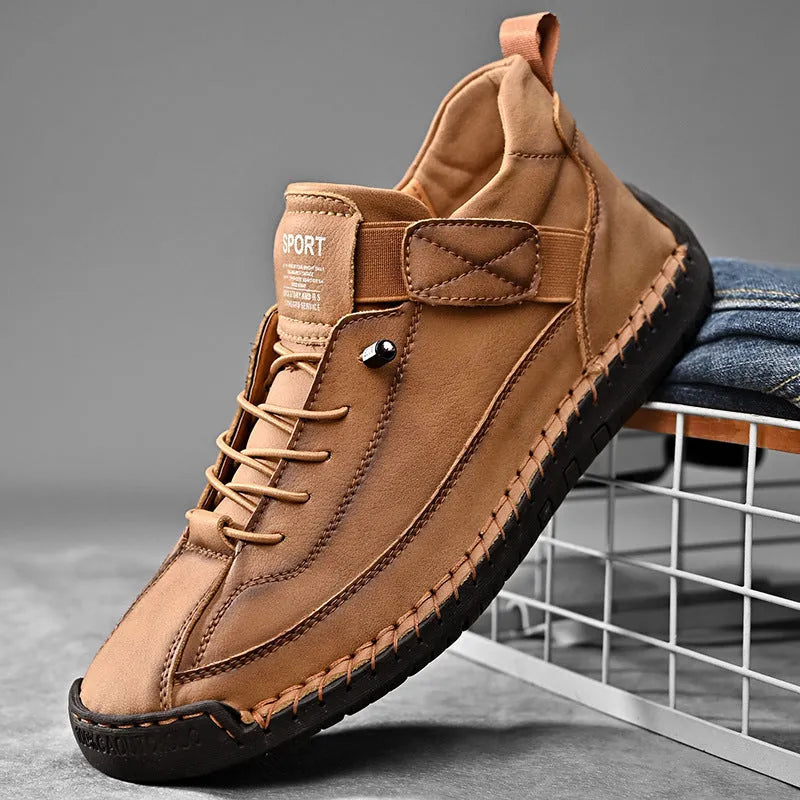 Men's mid-calf Martin boots in khaki with tooling stitching and an elastic band closure.