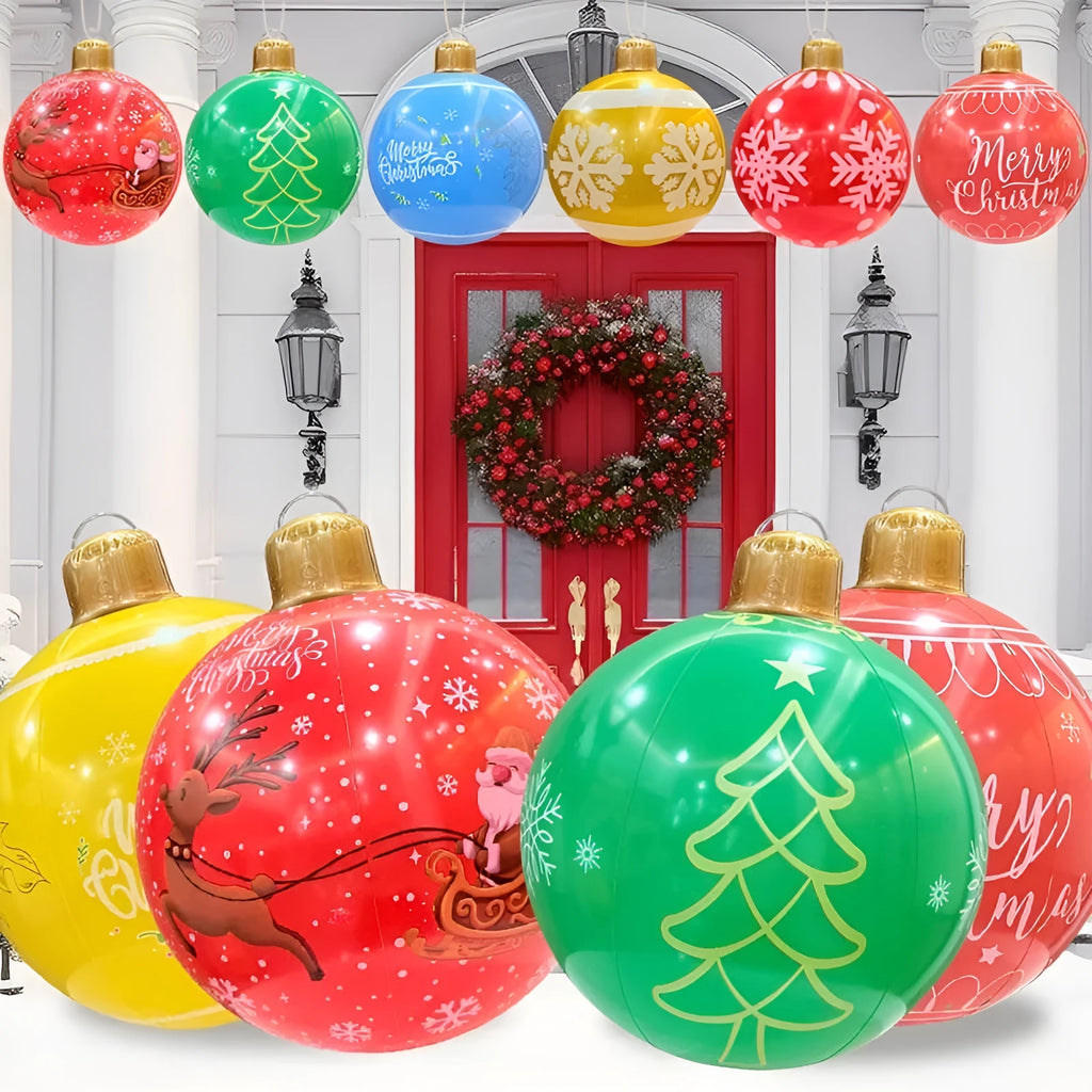 Large red inflatable Christmas ball with LED lights in a garden setting