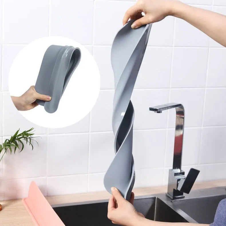Grey silicone kitchen sink water blocking plate showing dimensions on a countertop.