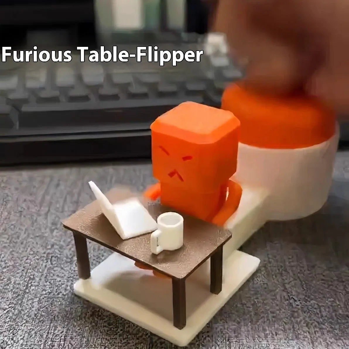 Orange plastic vent decompression toy on desk showing table turning mechanism