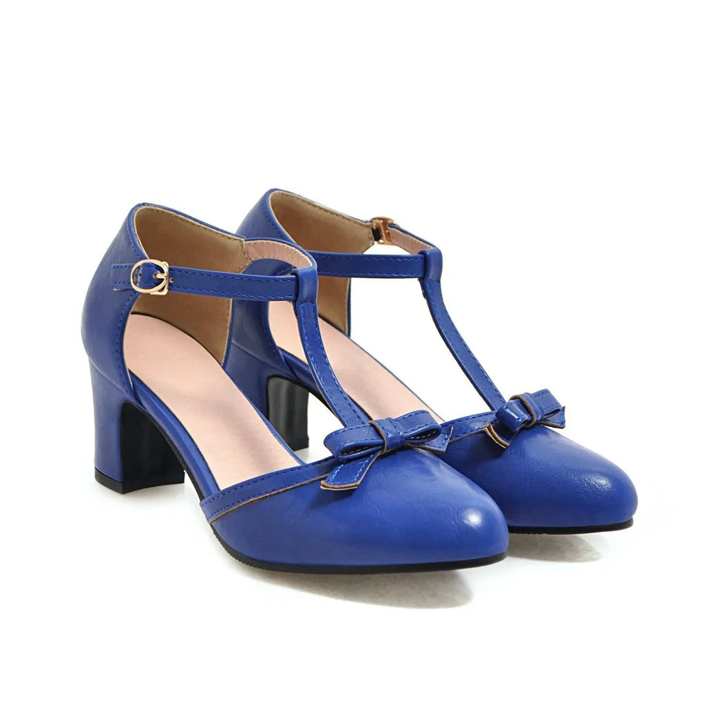 Yellow women's sandals with a chunky heel, buckle strap, and round toe.