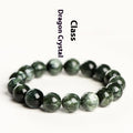 Natural green dragon crystal round bead bracelet with ruyi design on a wrist.