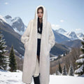 Long brown leopard print faux fur coat on a model, showing its loose fit and 100cm length.