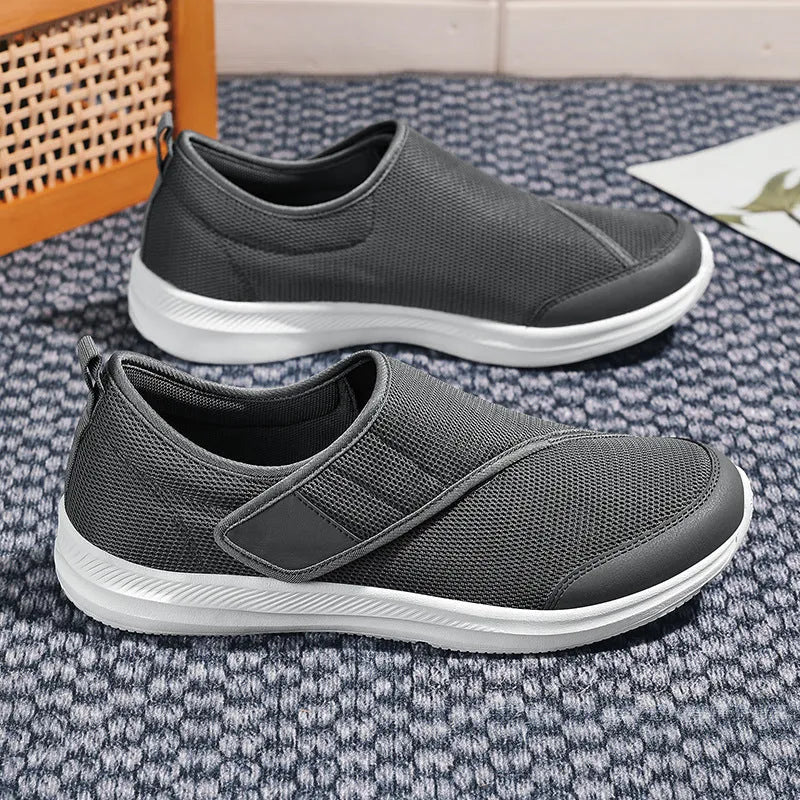 Outdoor mountaineering walking shoes with mesh upper, Velcro closure, and round toe in black