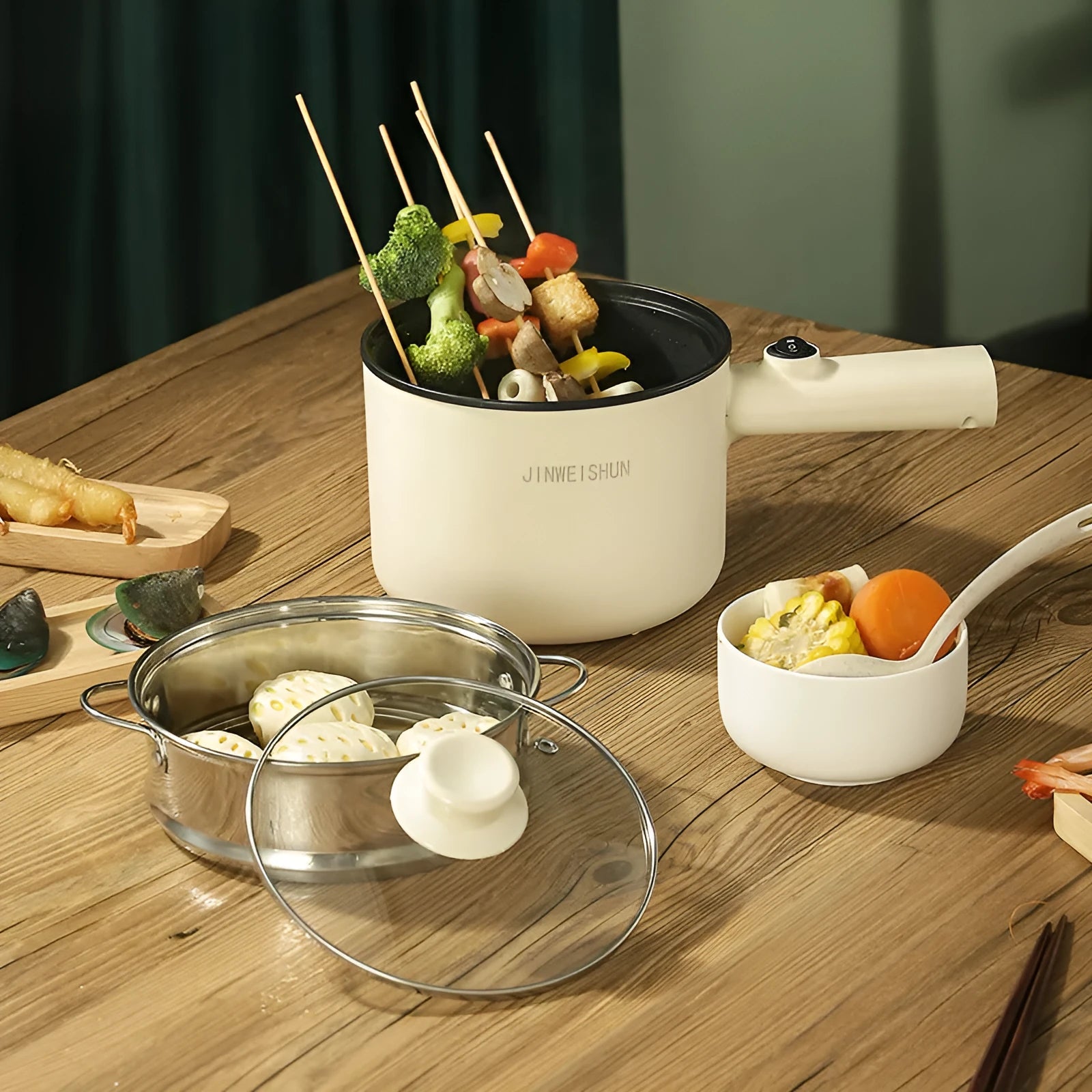 Mini hot pot electric cooker in green with stainless steel body, non-stick pot, and steam grid option for portable cooking
