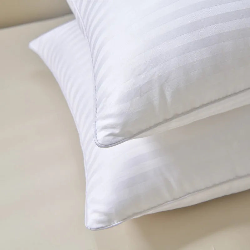 White cotton satin stripe feather pillow showing satin stripe detail on 99% cotton fabric.