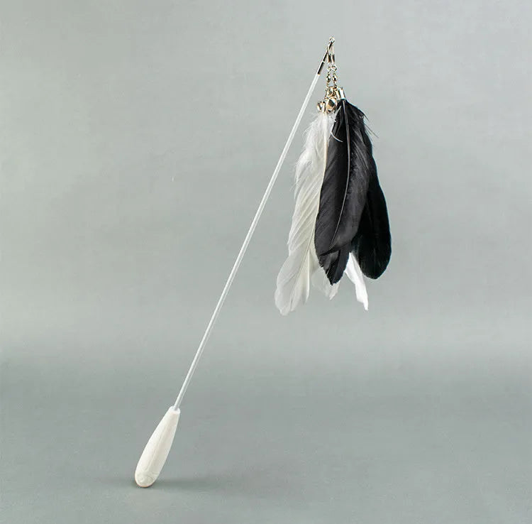 Telescopic cat fishing rod toy with self-hi bell and white goose feather lure on white shaft, extended for play