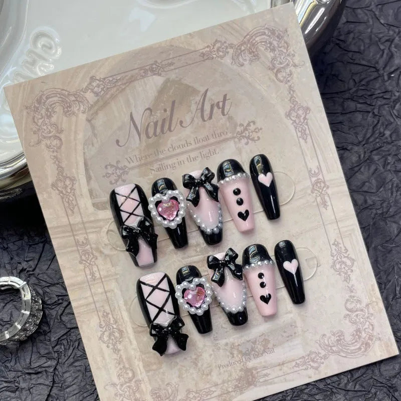 Black peach heart detachable manicure nails with hand-painted bow and XINGX patterns