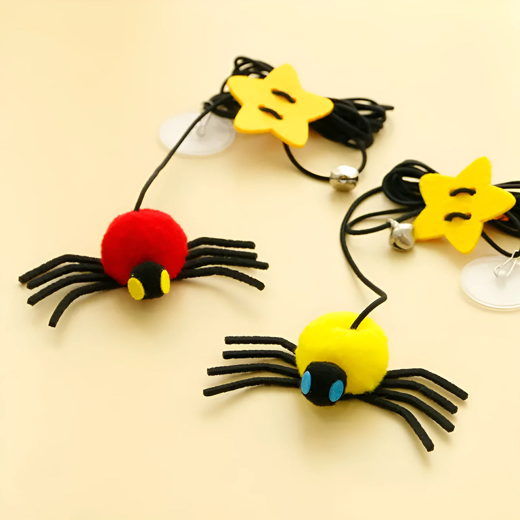 Hanging door cat toy with feather stick, bell, and spider attachment on elastic rope