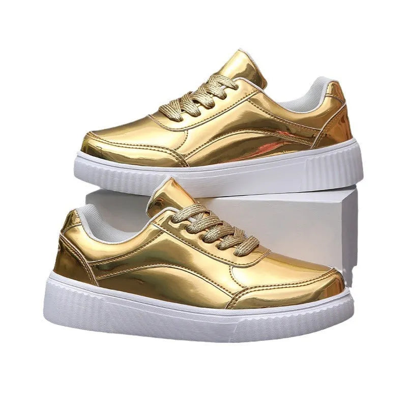 Gold sequined platform sneakers with round toe and thick MD sole on a white background.